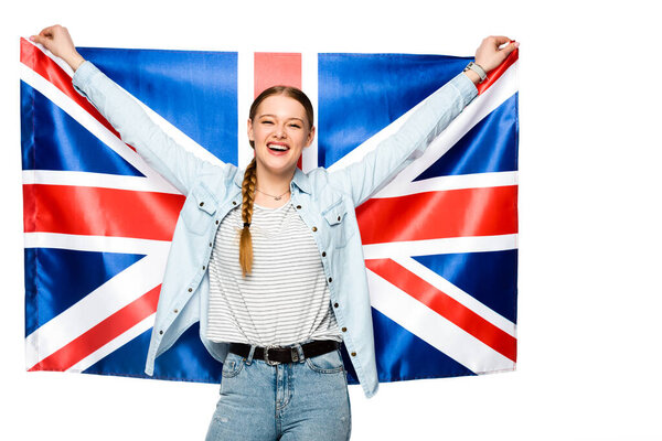 快乐漂亮的女孩，辫子上挂着英国国旗，与白色隔离 图片素材
