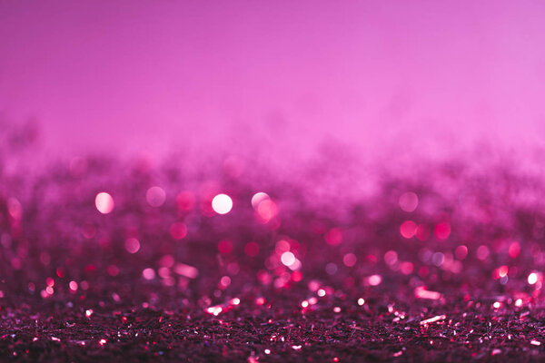 圣诞背景粉红色和紫色闪亮的五彩纸屑 图片素材