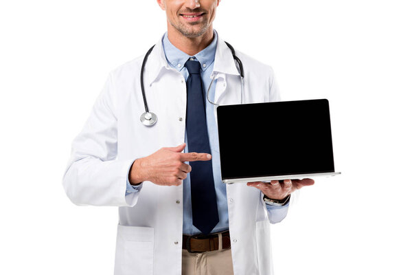 裁剪视图医生指指点点在笔记本电脑与空白屏幕隔离在白色 图片素材