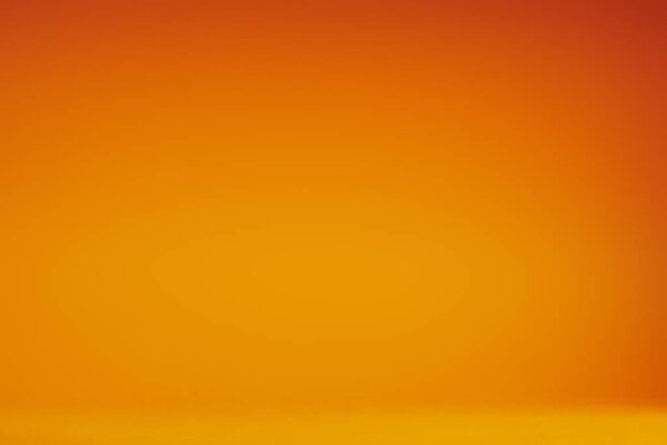 空的明亮的橙色抽象背景的完整的框架视图 图片素材