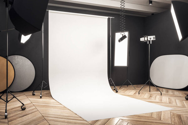 可以欣赏到现代照相馆内部的白色背景、专业设备和木地板。模拟, 3d 渲染  图片素材